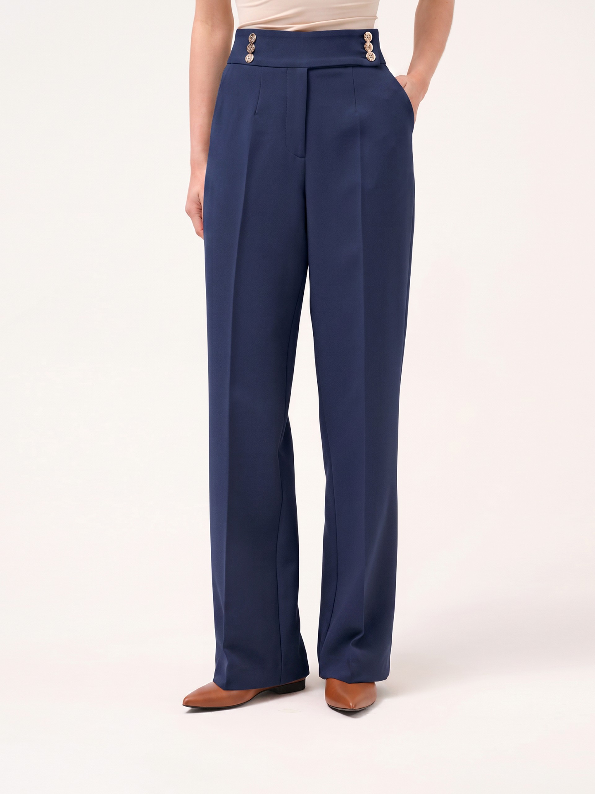 Trousers with buttoned strap