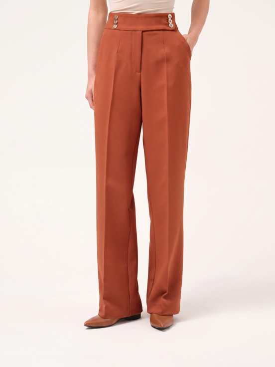 Trousers with buttoned strap