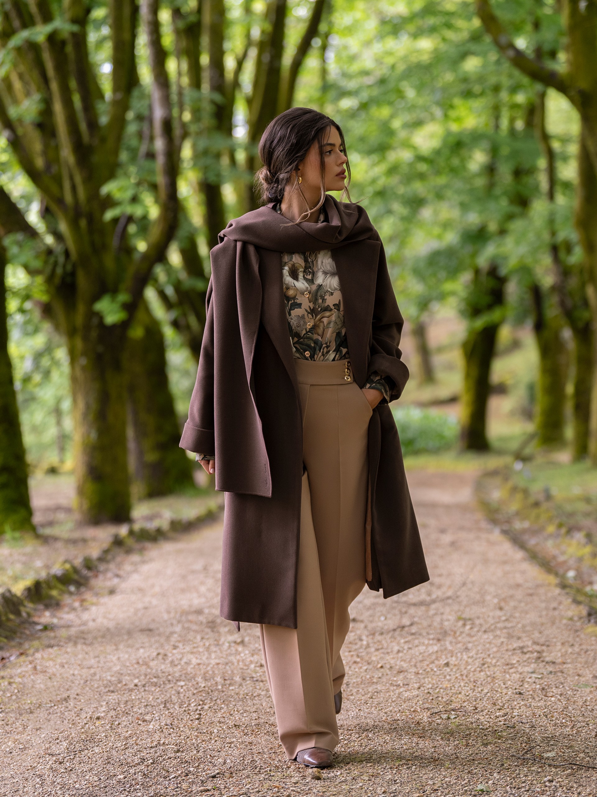 Trousers with buttoned strap
