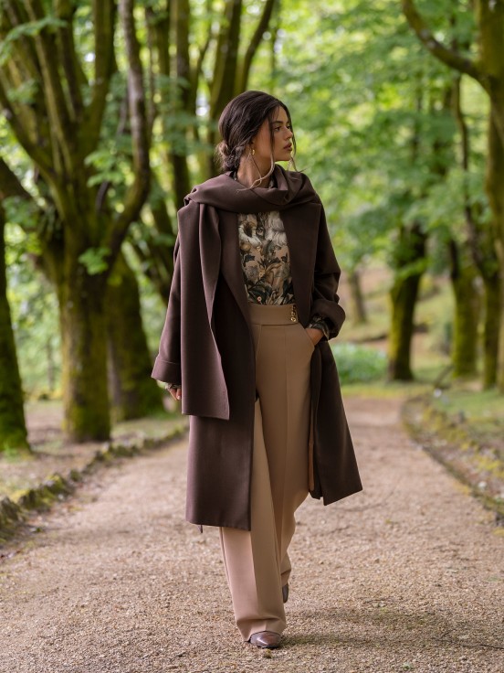 Trousers with buttoned strap
