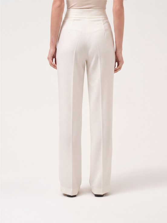 Trousers with buttoned strap
