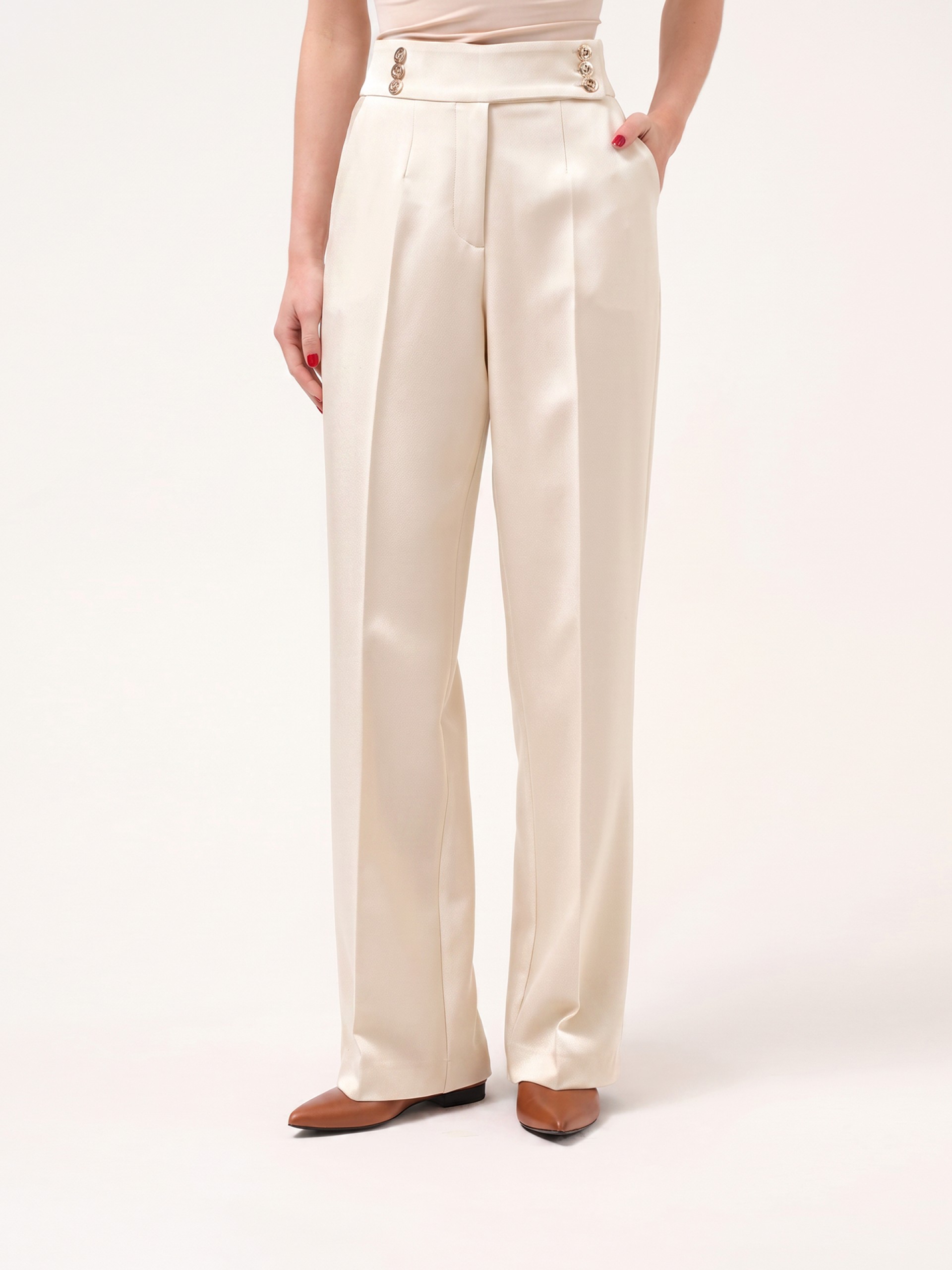 Trousers with buttoned strap